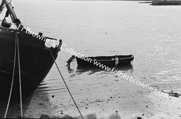 CHILD AT ROWING BOAT